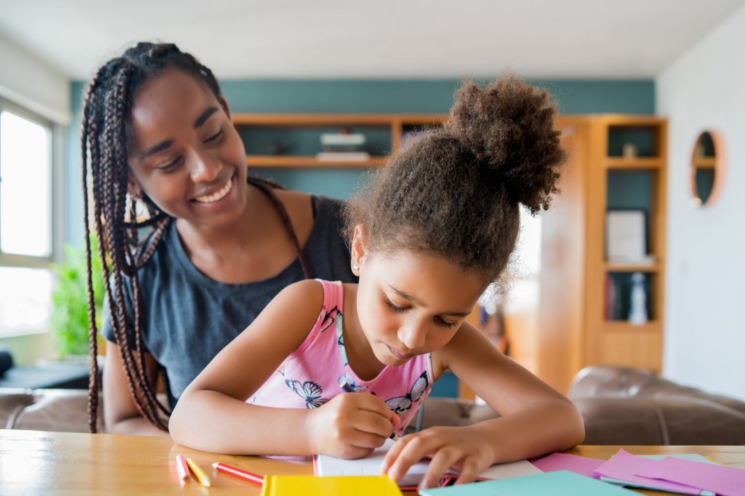 a-father-helping-her-daughter-with-homeschool-.jpg